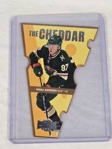lot 182 image: Kirill Kaprizov 2021-22 SkyBox Metal Universe The Cheddar Die Cut Insert #TC-7 - Minnesota Wild Hockey Card