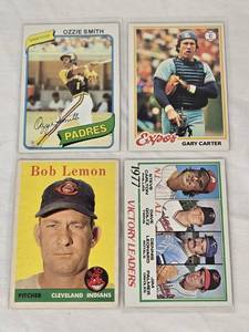 lot 185 image: Lot of 4 Vintage Baseball Cards Featuring Gary Carter, Ozzie Smith, Bob Lemon, and 1977 Victory Leaders