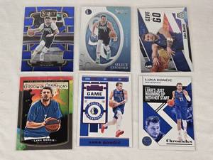 lot 216 image: Lot of 6 Luka Doncic Basketball Cards including Panini Select, Chronicles, and Goodwin Champions