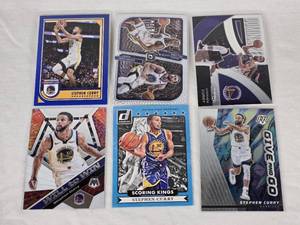 lot 247 image: Lot of 6 Stephen Curry Basketball Cards Including Donruss Scoring Kings, Panini Dominance, and Mosaic Will to Win with Golden State Warriors Features