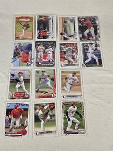 lot 267 image: Lot of 12 Shohei Ohtani Baseball Cards Featuring Various Sets and Notable Highlights Including 100 Career Home Runs and Elites of the Game.