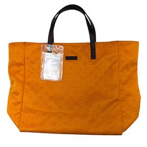 lot 65 image: Gucci Orange GG Canvas Tote with Brown Leather Handles Pre-Owned Retail $1,100