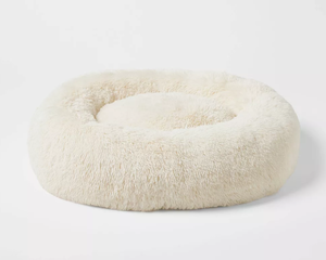 lot 147 image: Boots & Barkley Donut Bolster Dog Bed - Cream - L 36 Inches (L), 8 Inches (H) x 29 Inches (W)