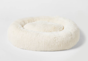 lot 148 image: Boots & Barkley Donut Bolster Dog Bed - Cream - XL 42 Inches (L), 8 Inches (H) x 32 Inches (W) (Stained From Trasnit But Washable, See Photos)