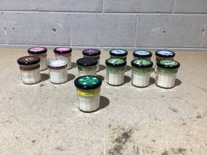 lot 145 image: LOT OF 13 Mrs. Meyers Clean Day Soy Candles (Variety Scents, 1 Missing Lid)