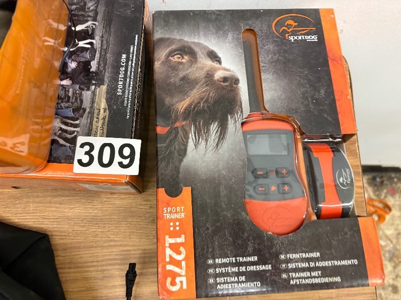 lot 309 image: Sport Dog 1275 trainer and new in package toys