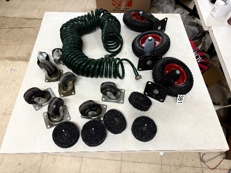 lot 381 image: Air hose and various size wheels