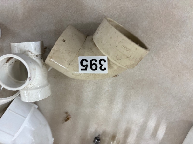 lot 395 image: Assortment of plumbing supplies