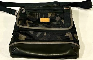 lot 131 image: TUMI Camouflage Crossbody Bag - Orange Interior