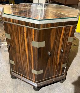 lot 30 image: Zebra Wood Octagonal Glass-Top Cabinet with Metal Trim & Round Wood Feet