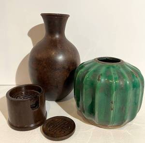 lot 66 image: Room & Board Brown Metal Vase & Green Distressed Vase with Asian Coasters in Holder