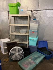 lot 82 image: Beige 4-Shelf Storage Rack - Plastic Totes & Lidded Boxes with Floor Fan & Tote filled with Gift Wrapping Supplies