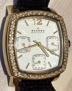 lot 205 image: Skagen Denmark 558SGLD8A Crystal-Bezel Gold Tone Watch & Black Leather Strap