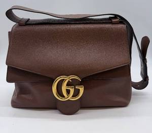 lot 212 image: Gucci Brown Pebbled Leather Shoulder Bag - Gold GG Logo Closure