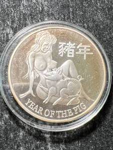 lot 21 image: 1 TROY OZ .999 FINE SILVER YEAR OF THE PIG ROUND IN AIRTITE