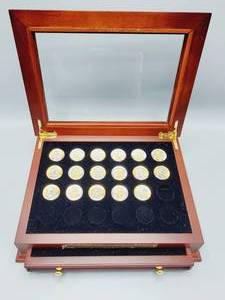 lot 68 image: 17 Sacagawea Dollars with Gold Highlites in Wooden Case