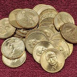 lot 77 image: 25 Presidential Dollars--Most Uncirculated