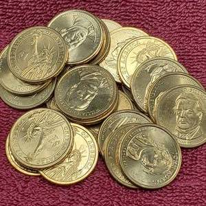 lot 78 image: 25 Presidential Dollars--Most Uncirculated