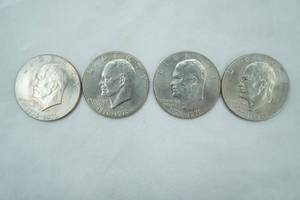 lot 45 image: 4ct 1776-1976 IKE Silver Dollars