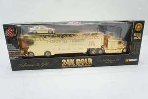 lot 81 image: Racing Champions NASCAR 24K Gold Plated Commemorative Series 164 scale transporter and stock car set