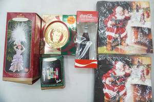 lot 154 image: Hallmark Keepsake Ornaments I Love Lucy, Vintage Barbie Coca-Cola Glass Ornament and New Vintage print Coca-Cola Napkins