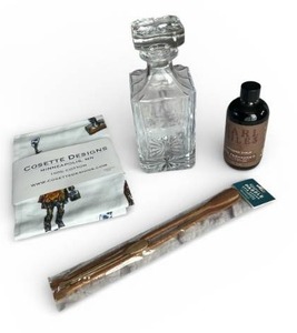 lot 21 image: New Moose Themed 8 Decanter, Sealed Earl Giles Bittered Syrup, New Paddle Stirring Sticks and More