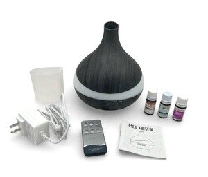 lot 22 image: Like New Essential Oils Diffuser with Three Essential Oils (Over Half Full)