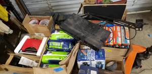 lot 53 image: Pallet of misc stuff lamps, cooker, trimmer, absorbent underwear, sprinkler, Wheaties boxes, desk lamp
