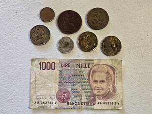 lot 11 image: Various Coins and Italian Lira Banknote Set including 1000 Lire Note, One Penny Coin, and Other International Coins