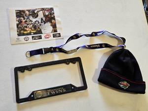 lot 25 image: Minnesota Twins License Plate Frame, Minnesota Vikings Lanyard, Autographed Minnesota Vikings Photo, and Minnesota Wild Knit Hat
