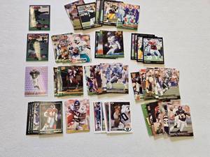 lot 31 image: Lot of Football Cards Featuring Key Players Including Harvey Williams and Aaron Glenn Rookie Cards