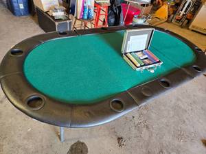 Poker Table with Chip Set including Texas Hold'em Poker Chips, Cards, and Case - some felt is folding over on one of the folds
