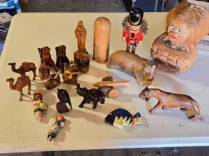 lot 58 image: Lot of Wooden Animal Figurines and Decorative Items such as dogs, cats, an elephant, and a camel
