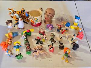 lot 62 image: Lot of Assorted Character Figurines and Toys Including Disney and Cartoon Characters including Tigger, Donald Duck, and Mickey Mouse