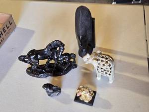 lot 64 image: Various Decorative Figurines and Sculptures including Horse Statues, Dolphin Figure, and Carved Elephant