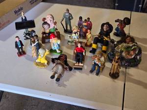 lot 66 image: Collection of Figurines and Miniature Statues Including Firefighter, Soldier, and Couple