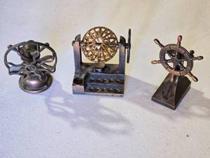 lot 72 image: Miniature Metal Pencil Sharpener Models Fan, Ferris Wheel, and Ship Wheel Set