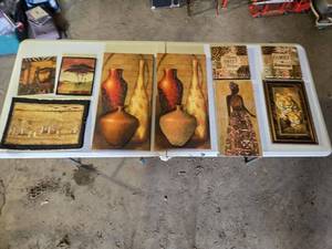 lot 83 image: African-Inspired Art and Decor Pieces including Framed Tiger Print, Vases on Canvas, and Tribal Woman Portrait