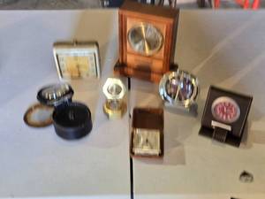 lot 87 image: Lot of Vintage Clocks and Timepieces including a Westclox alarm clock, a wooden quartz clock, and a travel clock with a date engraving