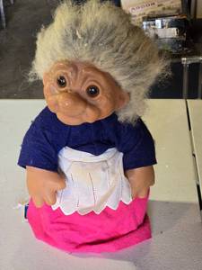 lot 90 image: Troll Doll with Apron - damaged fabric