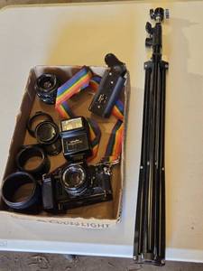 lot 98 image: Canon A-1 Camera with Canon FD 50mm Lens, Minolta Auto 200X Flash, and Tripod