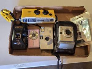 lot 99 image: Lot of Vintage Cameras including Canon PowerShot A60, Minolta Weathermatic, and Kodak KB32