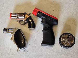 lot 104 image: Zico and Maven Gun and Tire Novelty Lighters