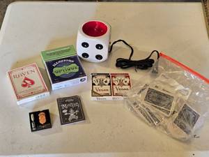 lot 108 image: Raven Giant Playing Cards, Illusions dOptique Game, Las Vegas Souvenir Coins, Funny Magic Booklet, Large Dice Cup Warmer, and Poker Cards