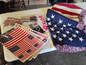 lot 146 image: American Flag Items including Window Clings, Decorative Blanket, and Car Decals