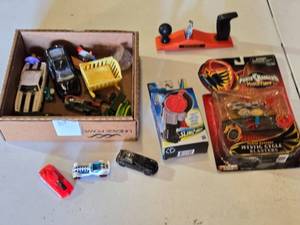 lot 161 image: Box of Toy Cars and Power Rangers Items including Black & Decker Toy Plane, Beyblade Slingshot, Power Rangers Mystic Cycle Blasters, and Matchbox Cars