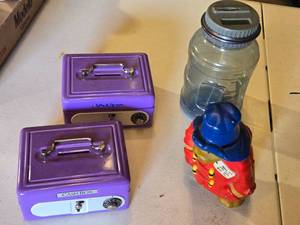 lot 163 image: Toy Cash Boxes and Coin Banks including Purple Cash Boxes, Bear Bank, and Plastic Jug Bank