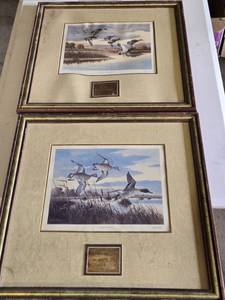 lot 197B image: John Mayer Framed Art Prints Dawn Patrol and Morning on the Platte with Brass Plates - Both in damaged condition