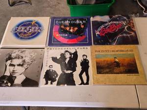 lot 221 image: Lot of Vinyl Records Featuring Beatles Greatest, Bee Gees, Duran Duran, Madonna, and More