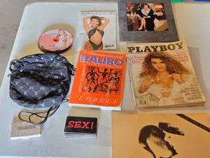lot 295 image: Playboy Magazine, Victorias Secret Catalog, and Other Adult-Themed Items Collection, Graphic Adult DVDs